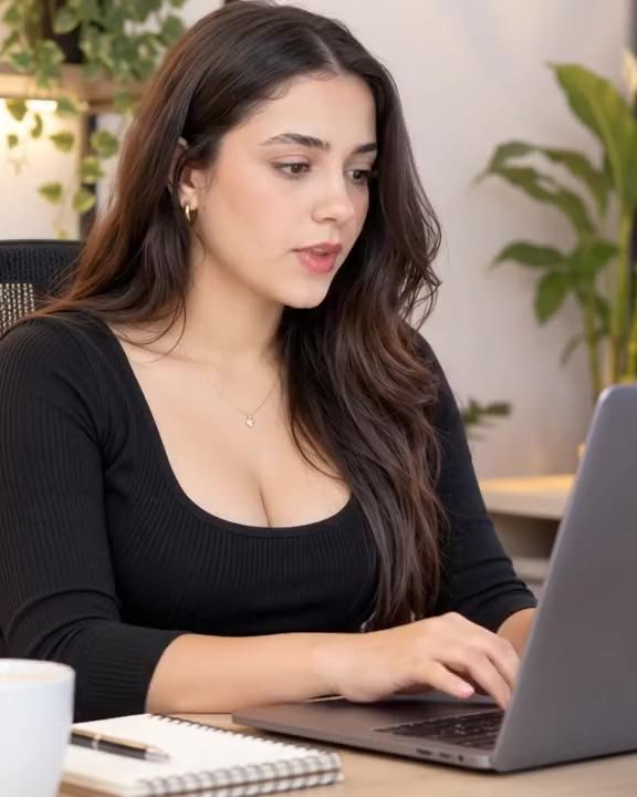 A creator working on her laptop with SEO for Tube